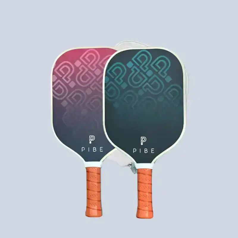 Two pickleball paddles with 'Pibe' branding on a light gray background
