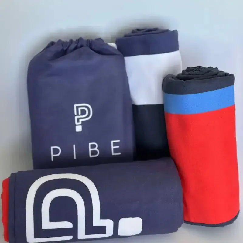 Kids at the beach with PIBE playful towels – soft, colorful, and vacation-ready