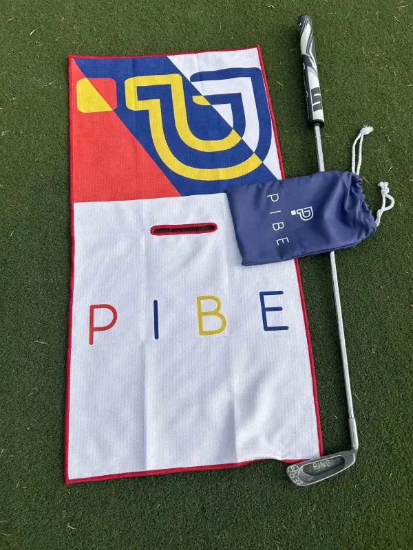 Stylish male golfer with PIBE golf towel – a must-have country club accessory